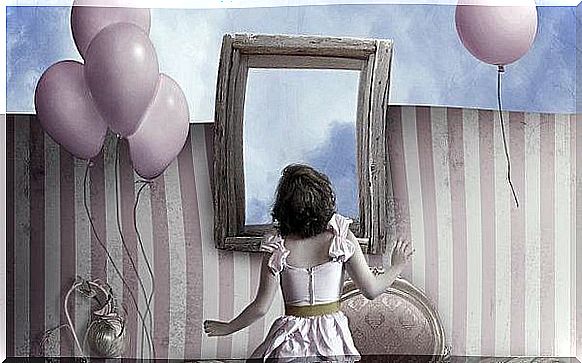 girl in front of mirror with balloons