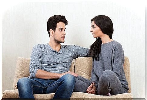 Couple having a conversation on the couch