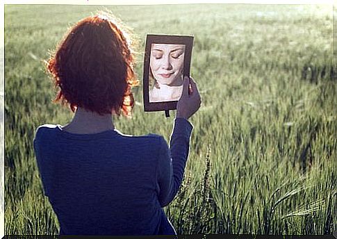 Woman looking in mirror