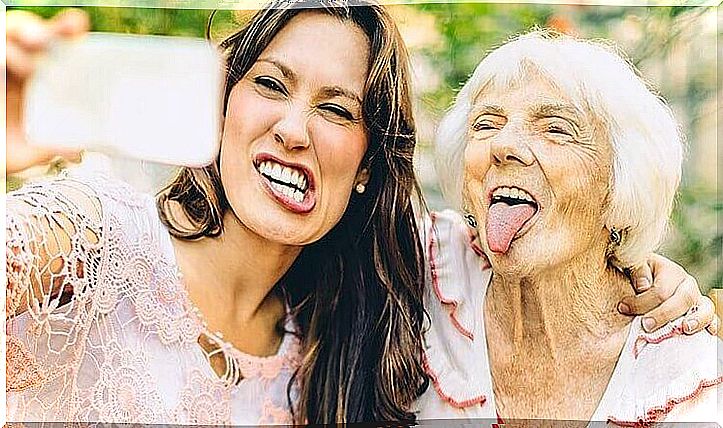 an older woman and a young woman taking a selfie