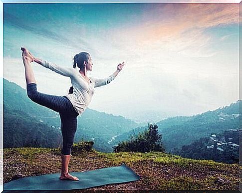 Woman doing yoga outdoors