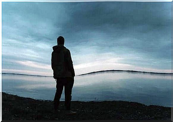 Man standing by the sea