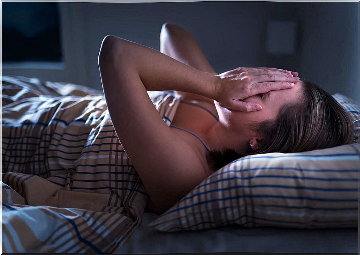 Woman with insomnia after chronic pain