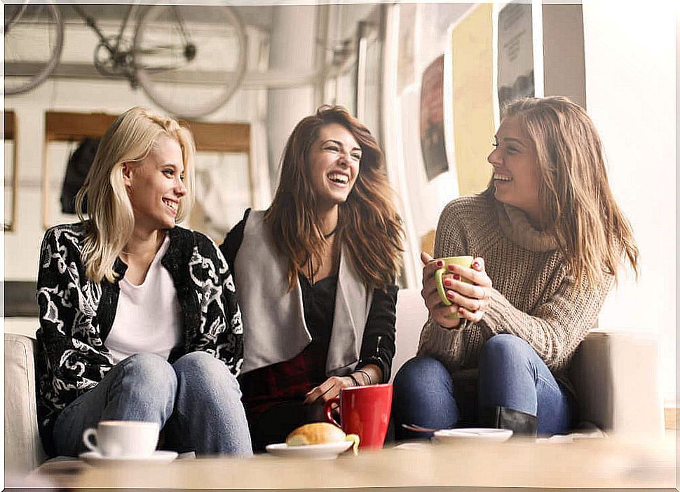 Three girlfriends laughing