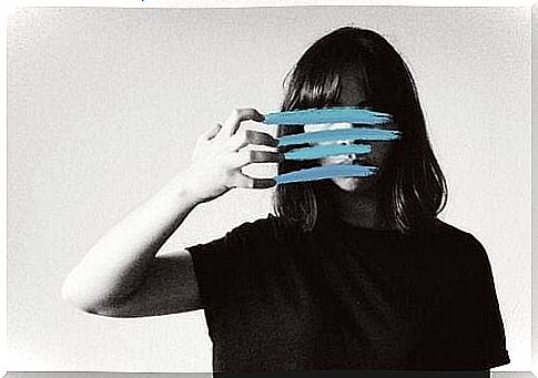 Woman with face covered in blue lines