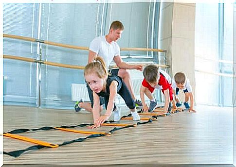 Three children exercising.