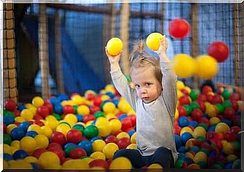 A child playing with balls.