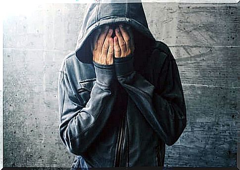 Person in hoodie crying