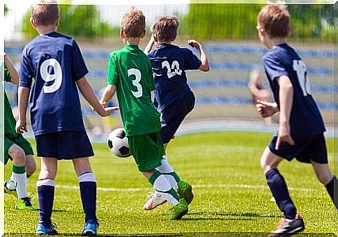 Children playing football.